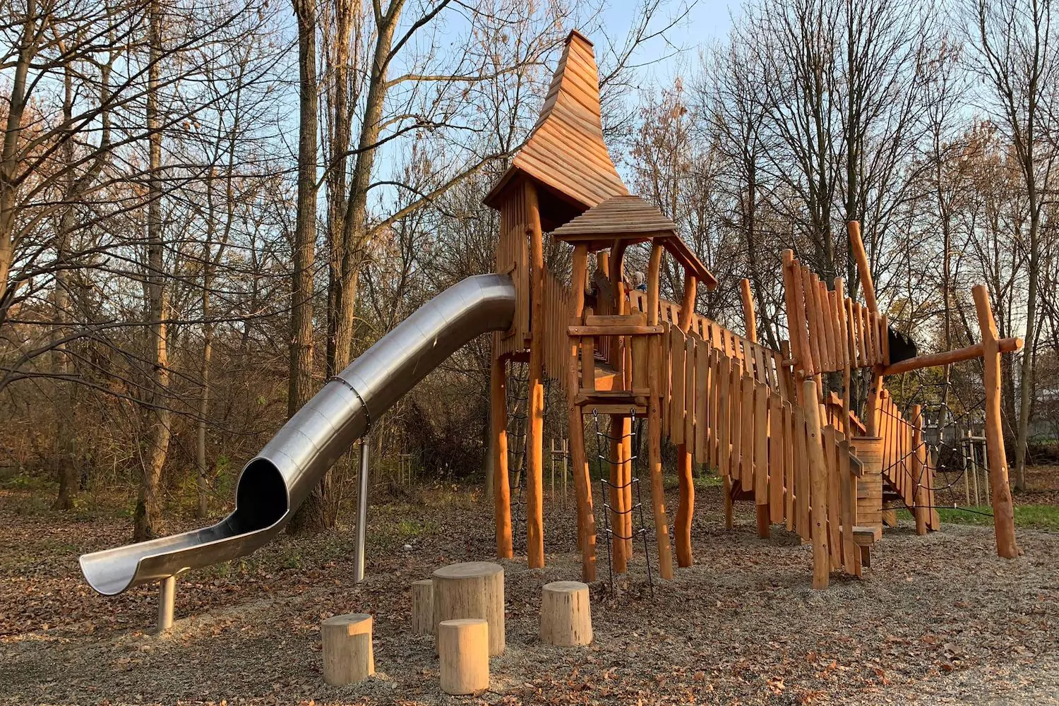 Playground steel tube slide in the park